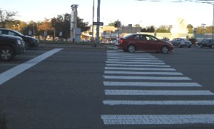 Red car blocking crosswalk